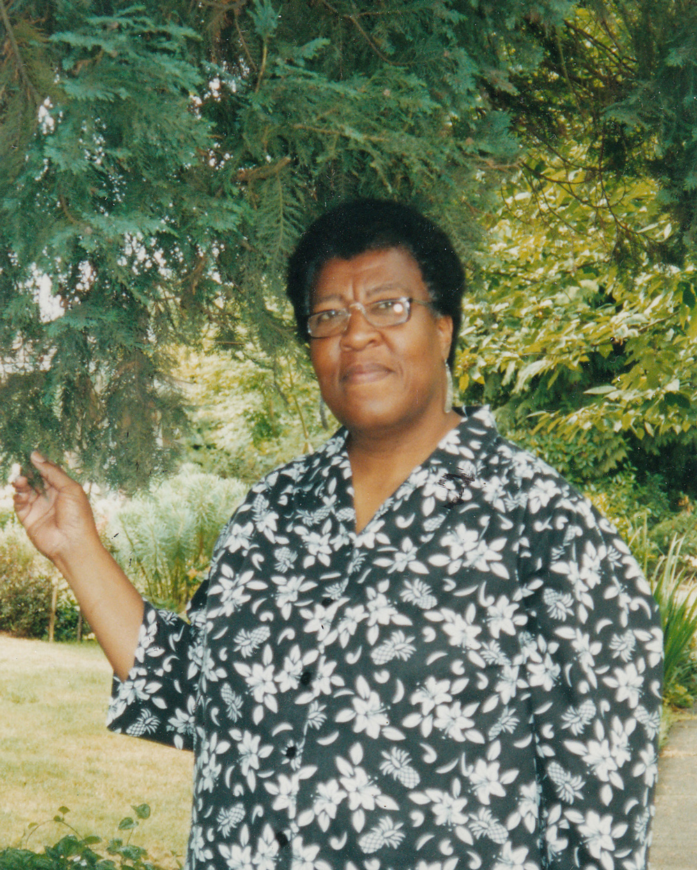 Octavia E. Butler standing by a tree.