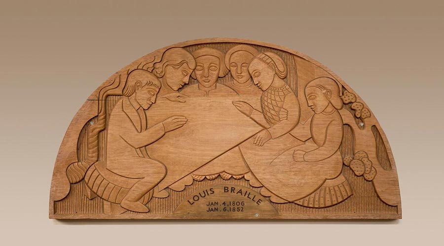 A mahogany wood art piece carved with people and shapes.