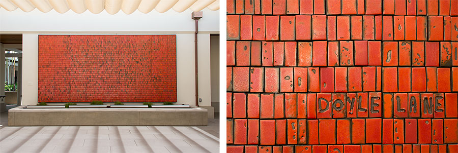 A large mural with red tiles (left) and a close-up view with “Doyle Lane” inscribed on it.