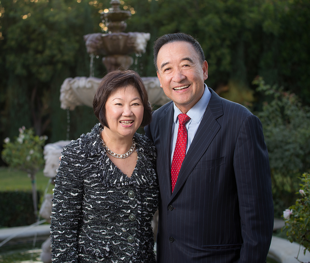 Man and woman standing in front of fountain