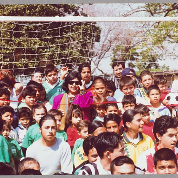 Gloria Molina standing with kids at Franklin D. Roosevelt Park