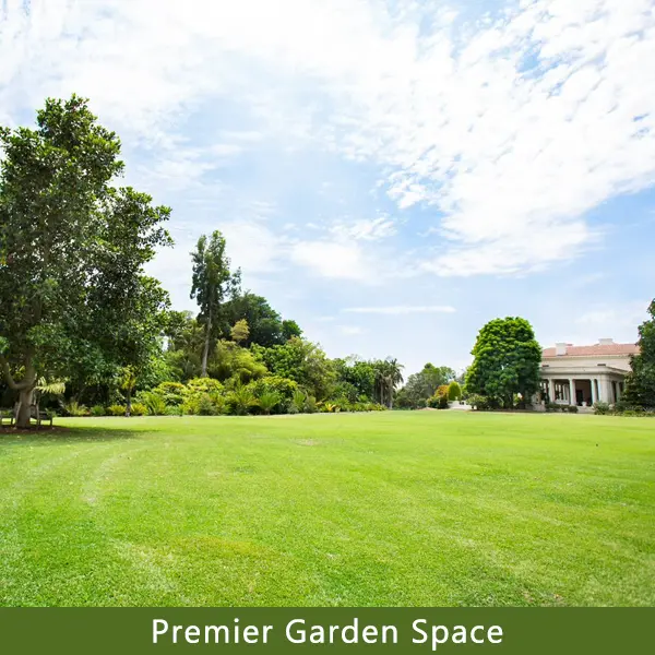 An expansive lawn leads to a 1911 home in the background.