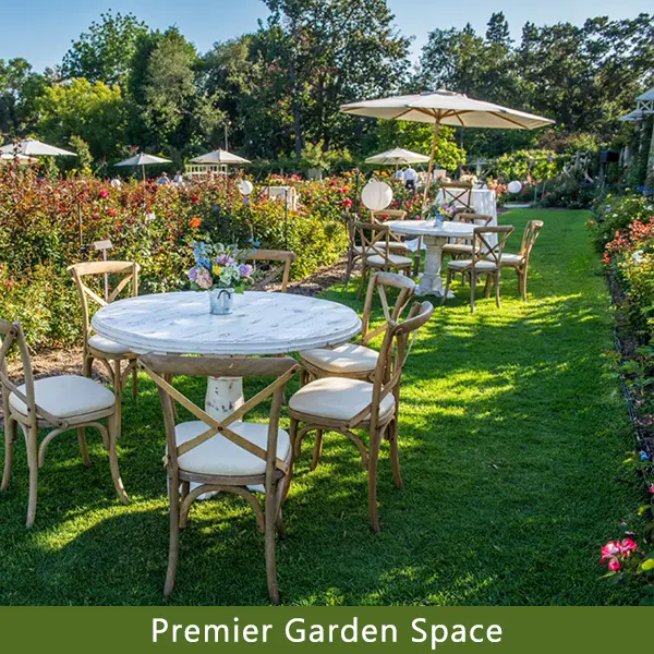 Tables set up in a rose garden.