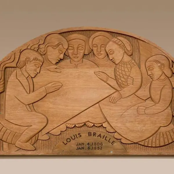 A mahogany wood art piece carved with people and shapes.