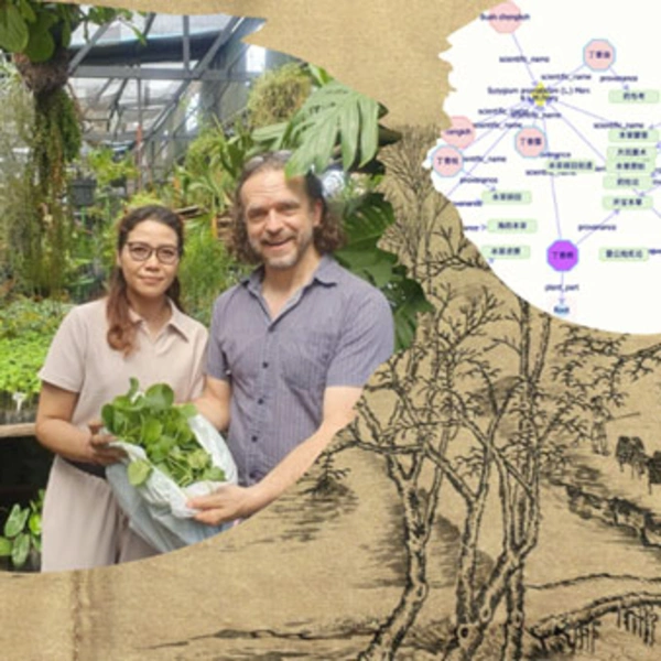 Two people inside a greenhouse revealing a green plant in a bag.