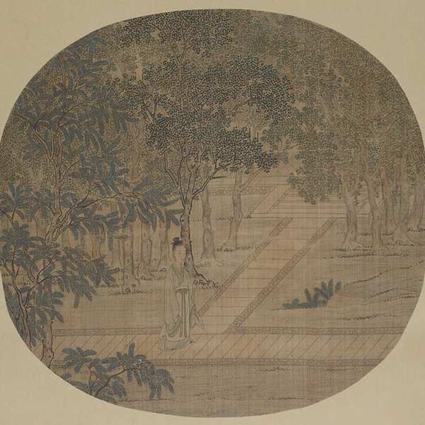 Round fan spread flat with drawing of a tree revealing walkways.