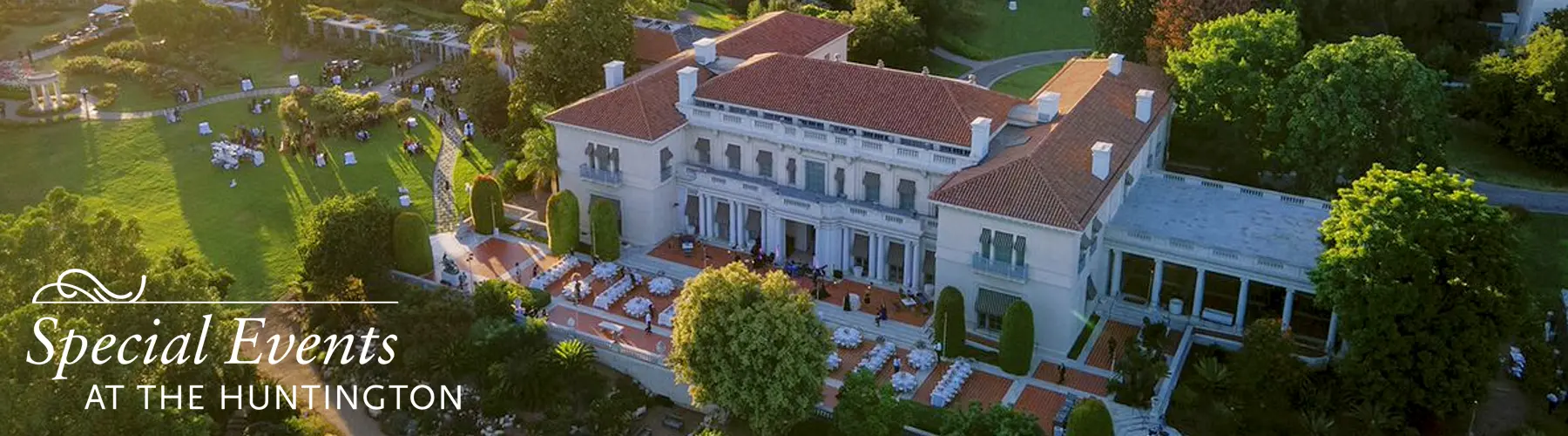 Overhead view of a grand 1911 estate home and garden set up for an event.