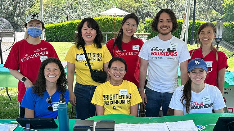 A group of volunteers wearing various matching tee shirts.