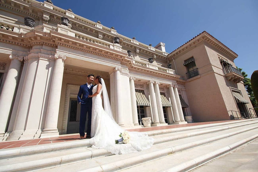 Wedding couple on the terrace of the Huntington Art Gallery