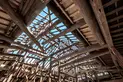 The original roof beams were used in the reconstructed framework of the house. 