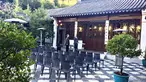 Rows of black chairs sit ready for a presentation.